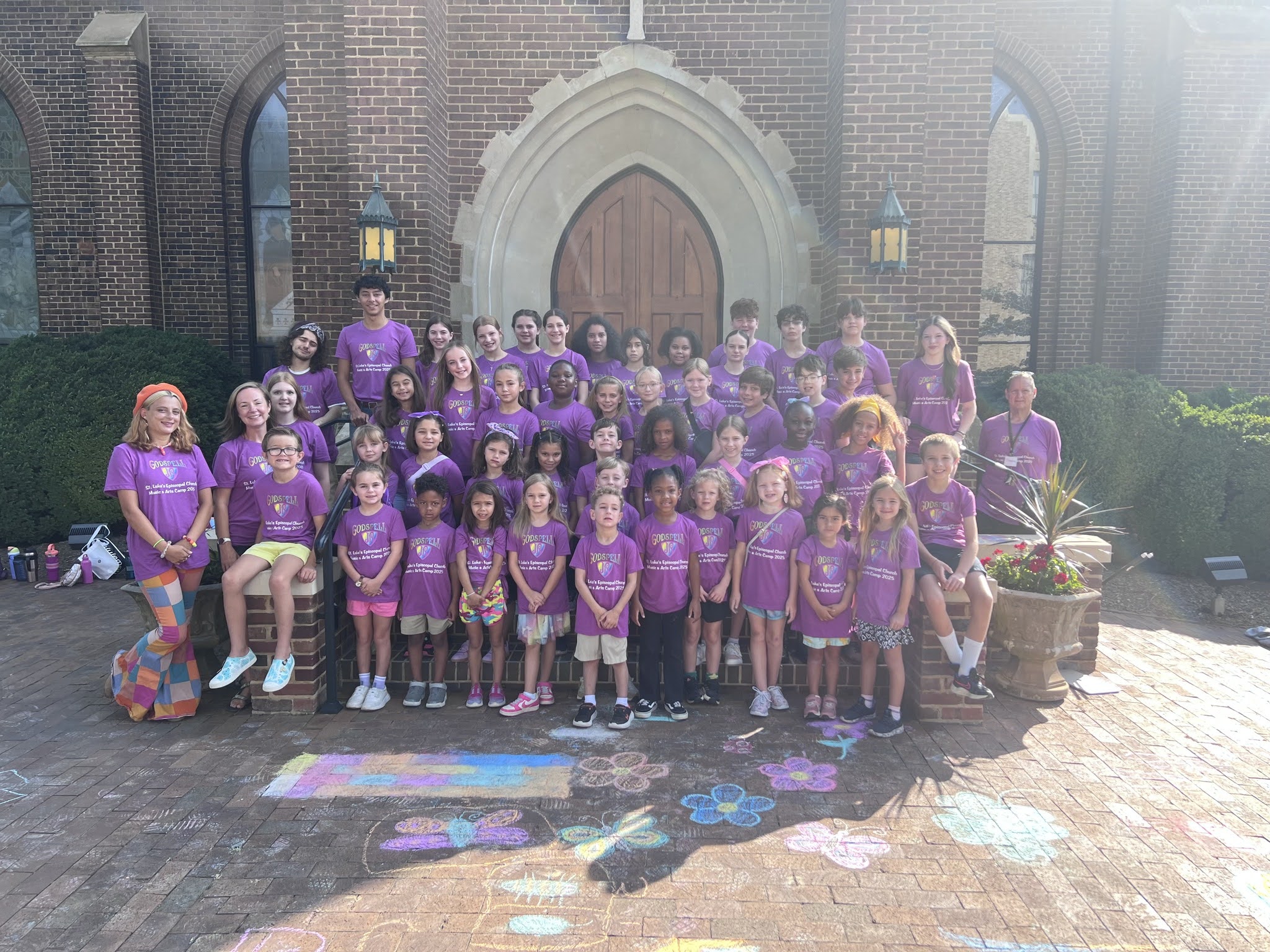 Children and youth gathered outside St. Luke's after music and arts camp
